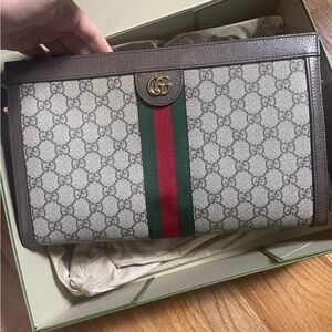 Gucci Ophidia GG Supreme canvas, with leather trim and Double G hardware.
